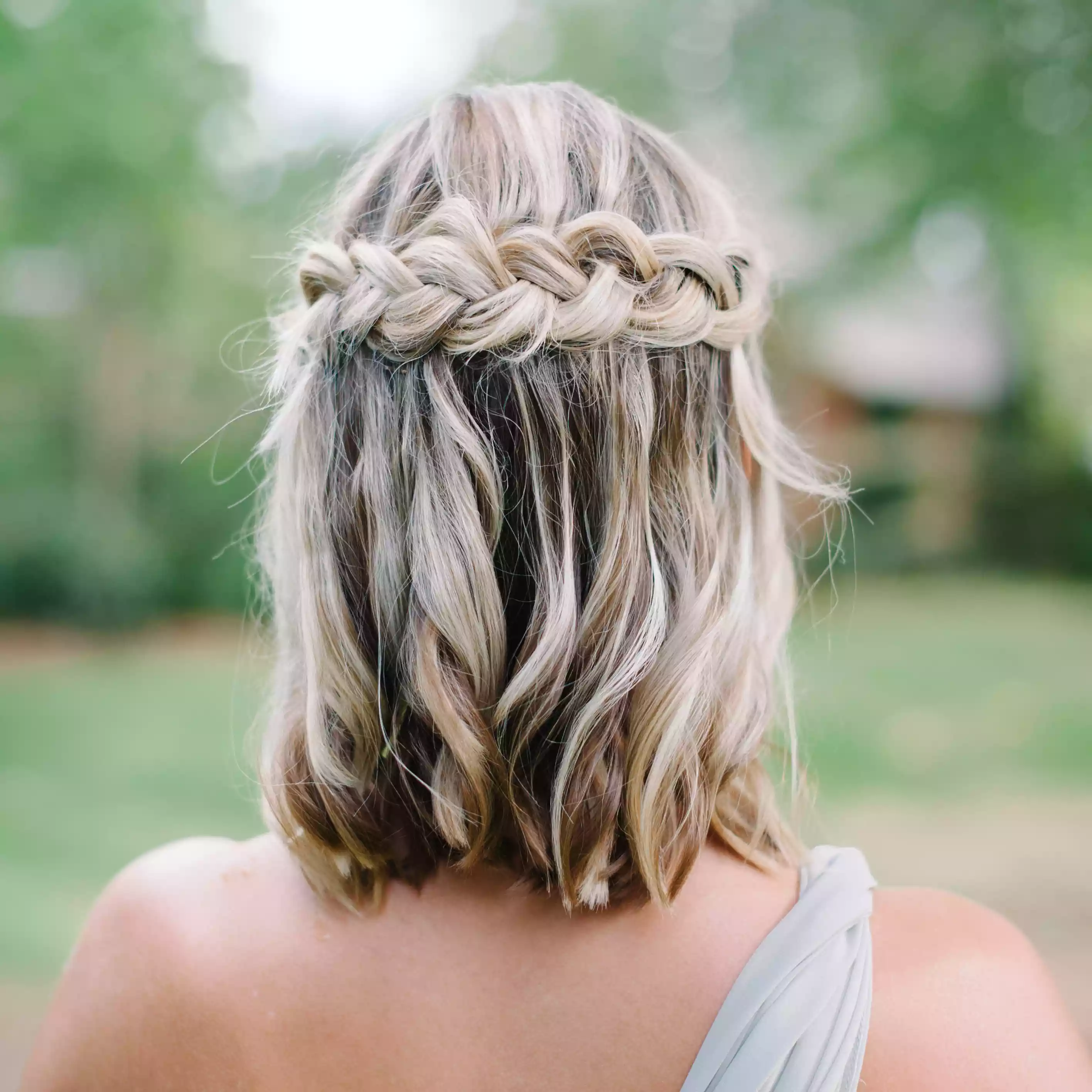 short bridal hairstyle with braid wrap across back of crown